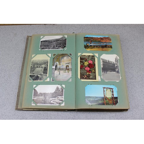 586 - Early 20th century postcard album and contents