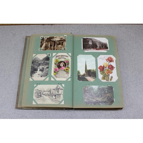 586 - Early 20th century postcard album and contents