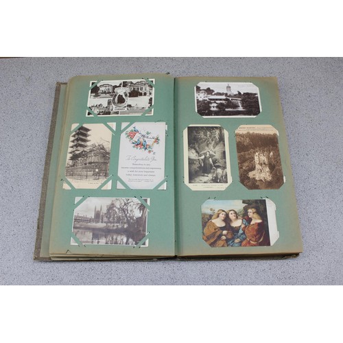 586 - Early 20th century postcard album and contents