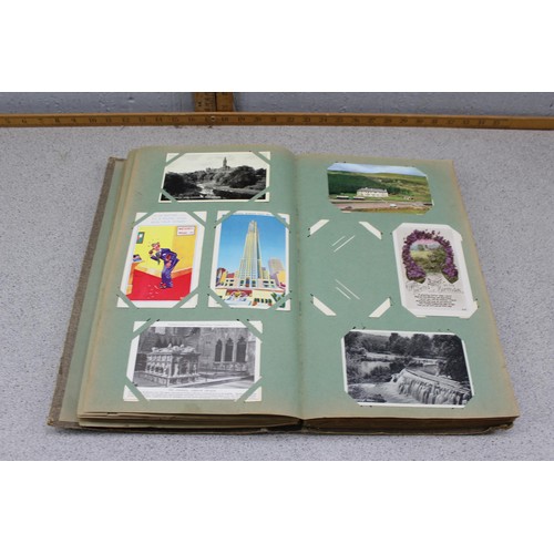 586 - Early 20th century postcard album and contents