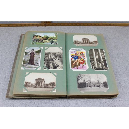 586 - Early 20th century postcard album and contents