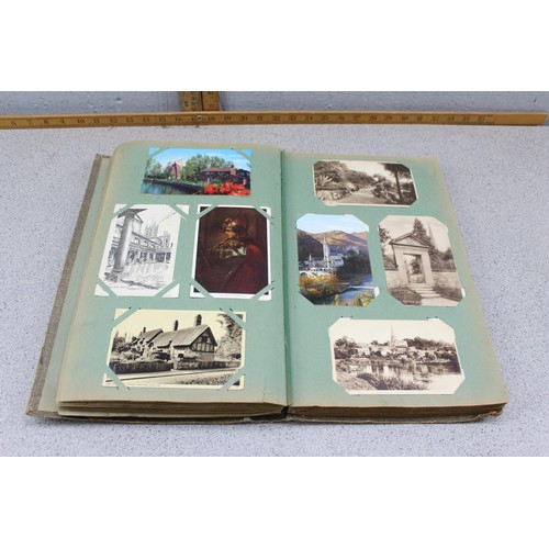 586 - Early 20th century postcard album and contents