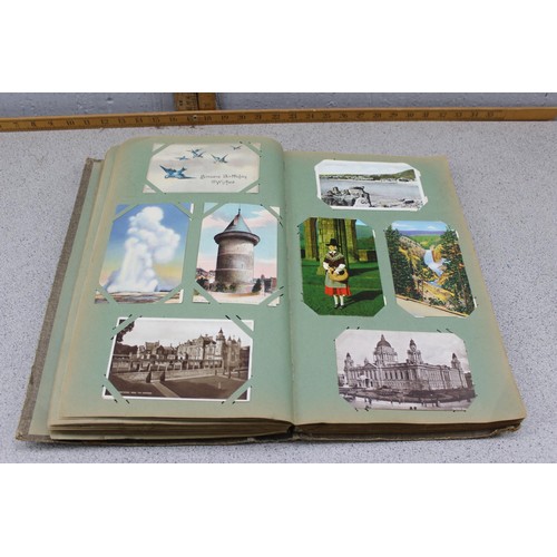 586 - Early 20th century postcard album and contents