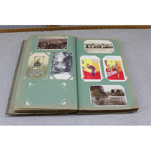 586 - Early 20th century postcard album and contents