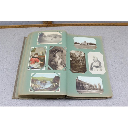 586 - Early 20th century postcard album and contents