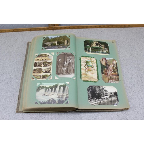 586 - Early 20th century postcard album and contents