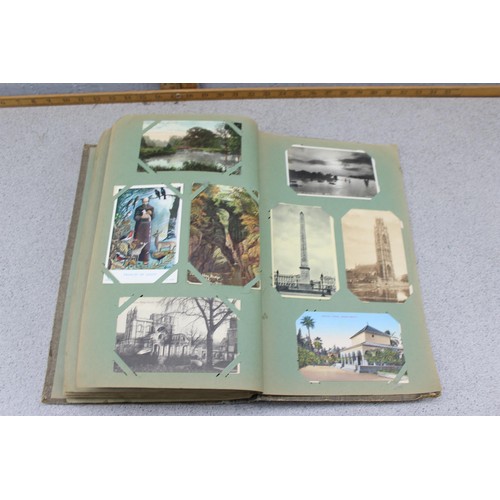 586 - Early 20th century postcard album and contents