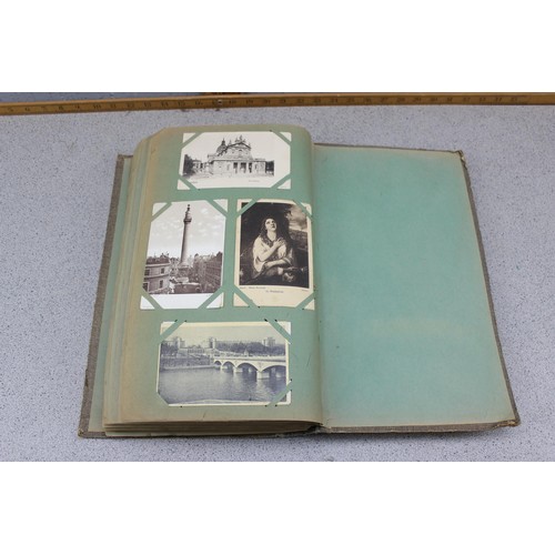 586 - Early 20th century postcard album and contents