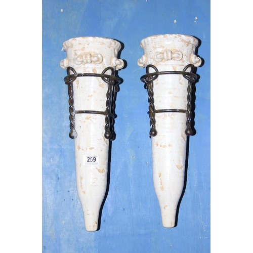 259 - A pair of vintage pottery and wrought iron wall bracket pockets, approx 50cm tall