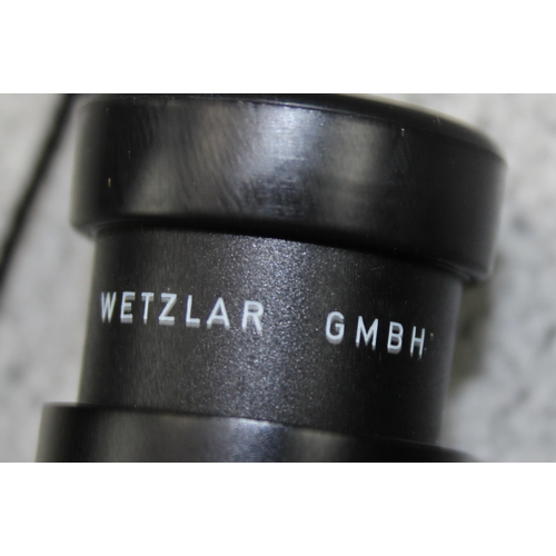 734 - A pair of Leica Leitz Trinovid 10 x 25 Binoculars