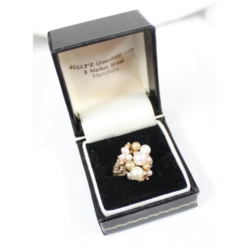 1115 - An unusual retro cocktail ring set with faux pearls and gold beads, import marks for London 1975, ap... 