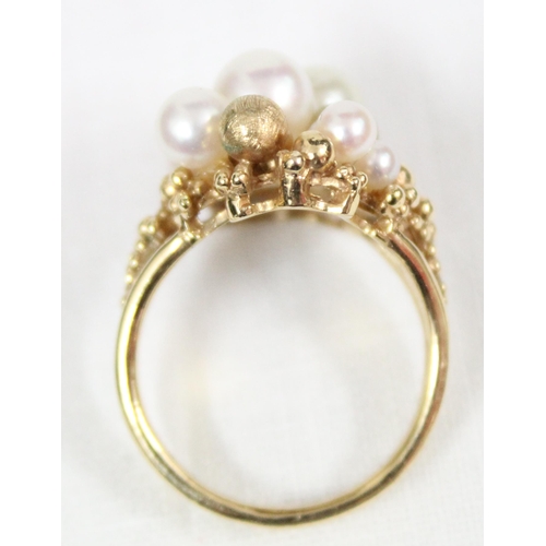 1115 - An unusual retro cocktail ring set with faux pearls and gold beads, import marks for London 1975, ap... 