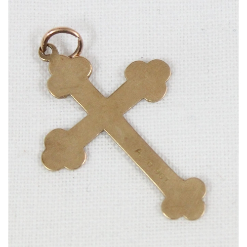 1132 - A 9ct gold crucifix pendant, approx 0.86g gross