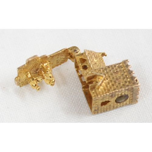 1137 - 9ct gold charm in the form of a church, opening to reveal a wedding scene, with Stanhope of the Lord... 