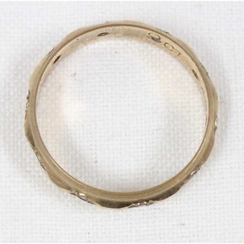 1147 - 9ct gold eternity ring set with small diamonds, approx size L. approx 1.91g gross