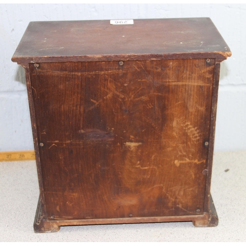 300 - An antique miniature 2 over 2 table top collector's chest of drawers