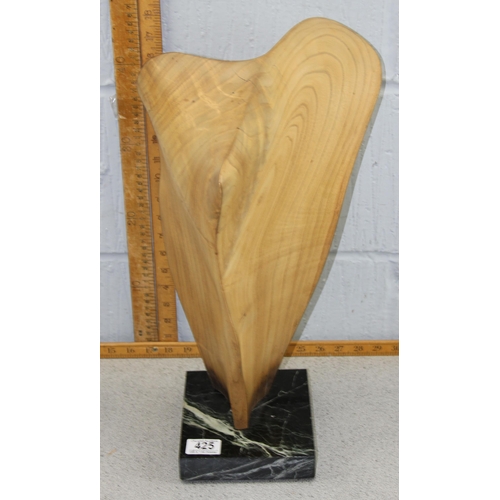 530 - A very interesting abstract wooden sculpture, believed to be teak. Mounted on a marble base and scra... 