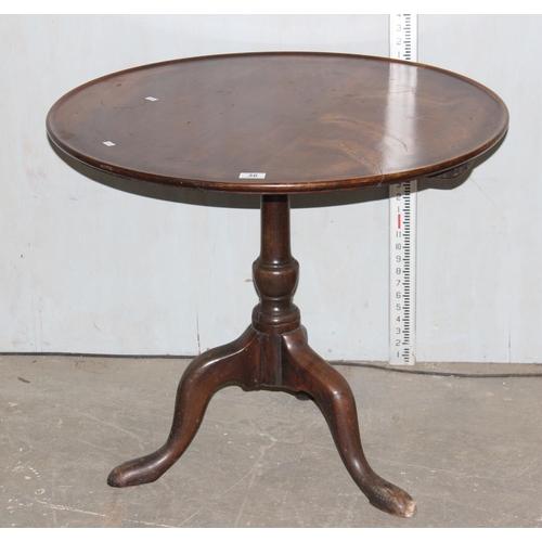 70 - A George III mahogany tilt top tripod table with dished top raised on turned column