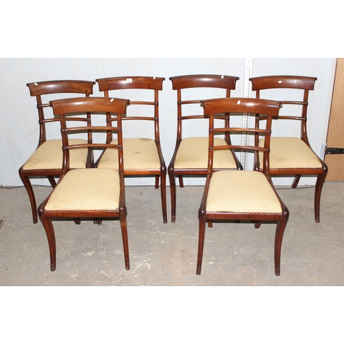 68 - A set of 6 late Regency or William IV rail back mahogany dining chairs with drop in seats and sabre ... 