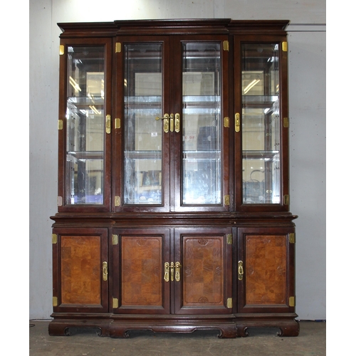 83 - A large antique style 4 door display cabinet with mirrored back and interesting brass furniture