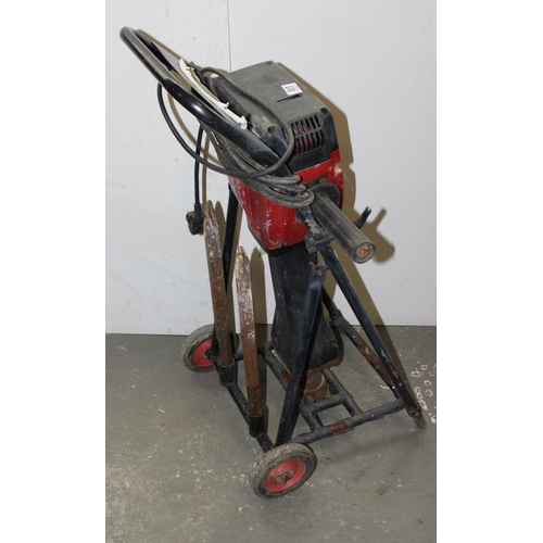 889 - TTD9 concrete breaker or jack hammer on trolley, with 2 bits