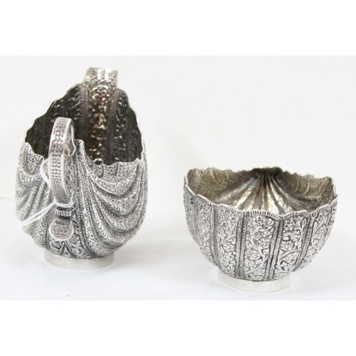 1070 - A heavy silver sugar bowl and cream jug, likely of Middle Eastern or Indian origin, unmarked but XRF... 