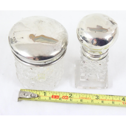 1082 - 2 early 20th century silver topped and cut glass jars