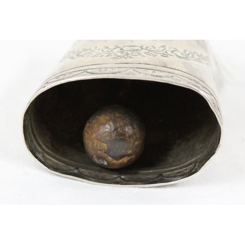 1084 - An unusual miniature silver cow bell with engraved decoration, unmarked but XRF tested approx 90% pu... 