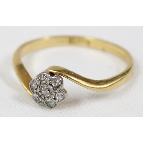 1165 - 18ct gold and diamond ring with a floral crossover setting, approx size N, approx 2.16g gross