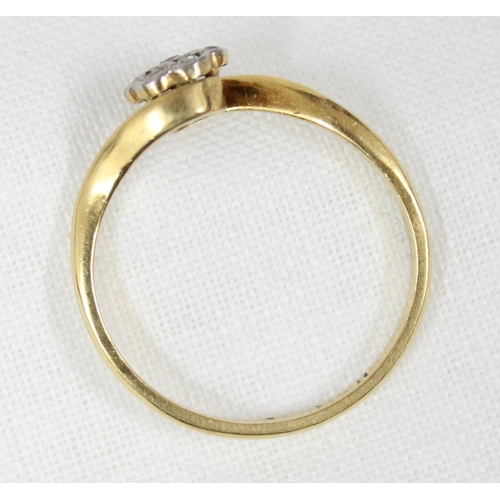 1165 - 18ct gold and diamond ring with a floral crossover setting, approx size N, approx 2.16g gross