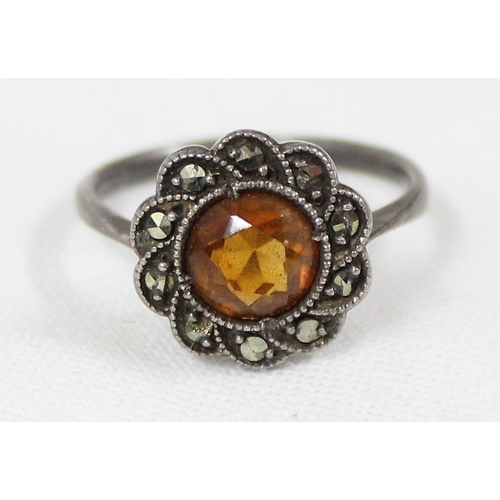 1166 - 2 silver rings, one an eternity ring set with white stones and another with orange stone and marcasi... 