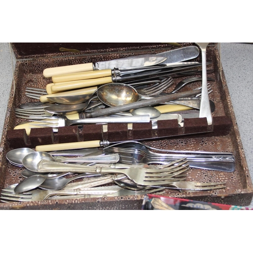 1087 - A large qty of assorted silver plate and stainless steel cutlery, some boxed