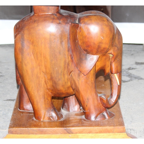 159 - Mid-century hardwood coffee table with elephant supports