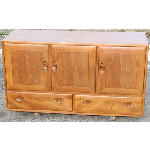 161 - A retro blonde Ercol 3 door 2 drawer sideboard, approx 130cm wide