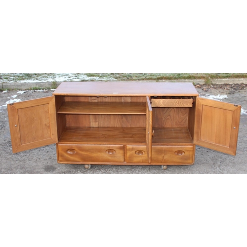 161 - A retro blonde Ercol 3 door 2 drawer sideboard, approx 130cm wide