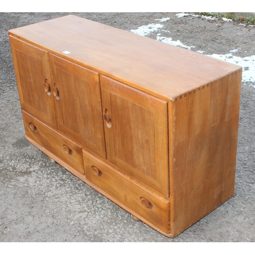 161 - A retro blonde Ercol 3 door 2 drawer sideboard, approx 130cm wide