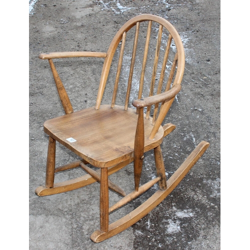 163 - A mid-century blonde Ercol rocking chair