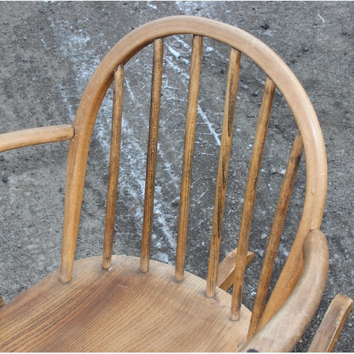 163 - A mid-century blonde Ercol rocking chair