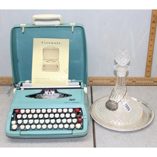 1886 - A glass ships decanter on silver plated stand with brandy label and a vintage Corsair typewriter