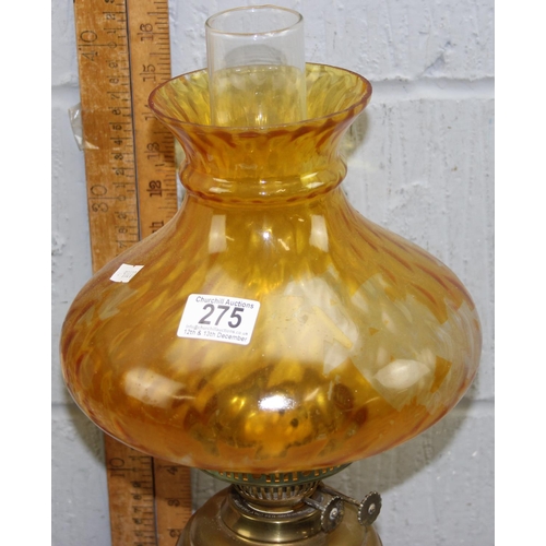 275 - A retro style table lamp and a vintage oil lamp with amber glass shade