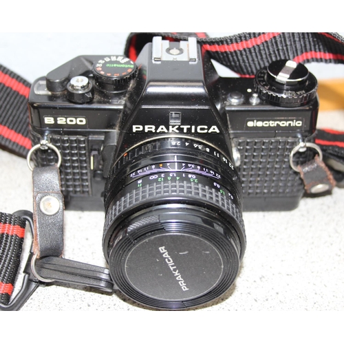 740 - Praktica B200 camera body and 4 Praktica lenses with instructions and carry case