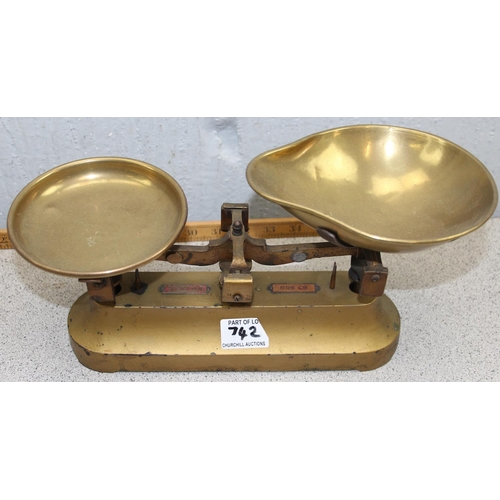 742 - Oakley vintage shop scales and a small brass balance scale set with stacking weights