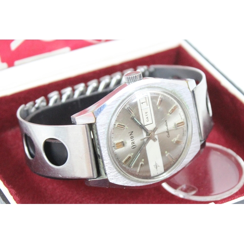 1347 - A retro Orion 83232 2030 calendar watch, in original box with stainless steel strap and paperwork da... 