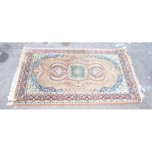 206 - A finely decorated rug of gold ground, approx 165cm x 94cm