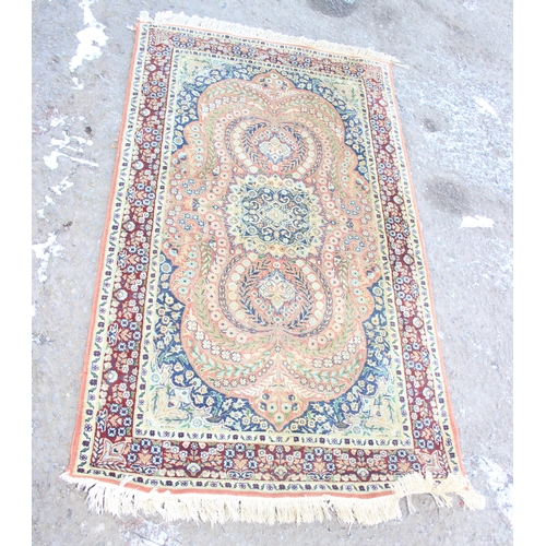 206 - A finely decorated rug of gold ground, approx 165cm x 94cm