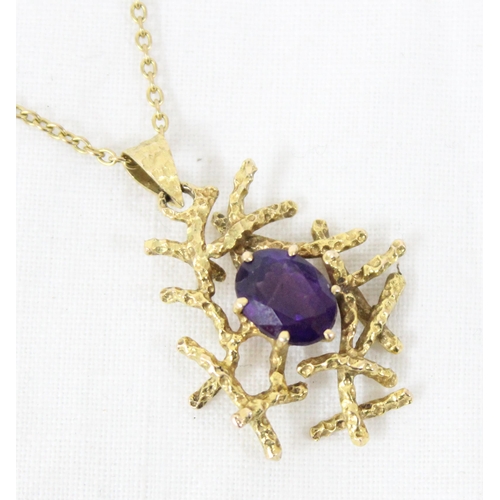 1122A - A retro bark effect 9ct gold and amethyst set pendant on chain by Cropp & Farr of London, chain mark... 