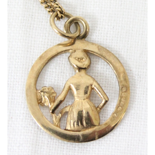 1199Y - An Italian 9ct gold pendant depicting a female with a flower, marked for London 1979, on a 9ct gold ... 