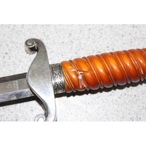 1465 - WW2 German Army Officers Dagger by Puma of Solingen, example with amber coloured Bakelite grip, pomm... 