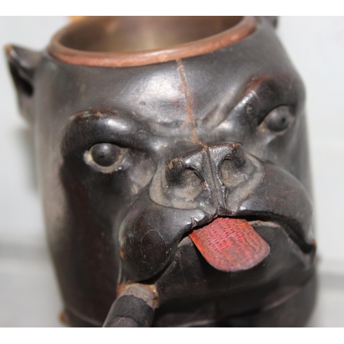 1636A - An unusual late 19th or early 20th century cigar ashtray formed as a dog smoking a cigar, hand carve... 