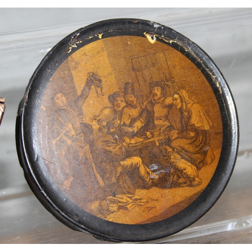 1699Y - A 19th century papier mache snuff box with printed lid depicting a tavern scene, a Japanese lacquer ... 